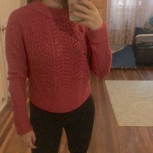 Bright pink cable knit sweater